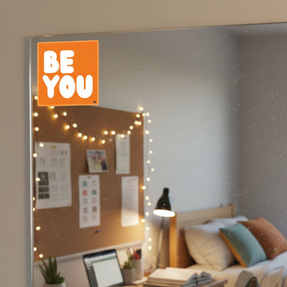 The APWT Gift Shop's Be You in Orange Vinyl Sticker stuck to a mirror