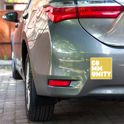 A Community in Yellow Vinyl Sticker on a car bumper- The APWT Gift Shop