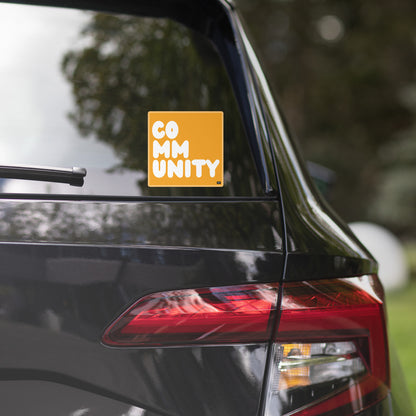 A Community in Orange Vinyl Sticker on a car window - The APWT Gift Shop