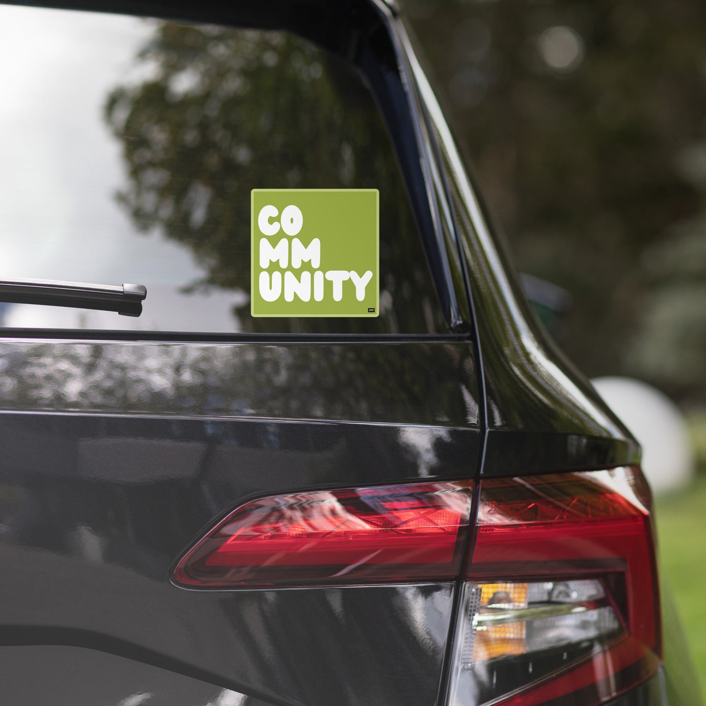 A Community in Lime Green Vinyl Sticker on a car's back window - The APWT Gift Shop