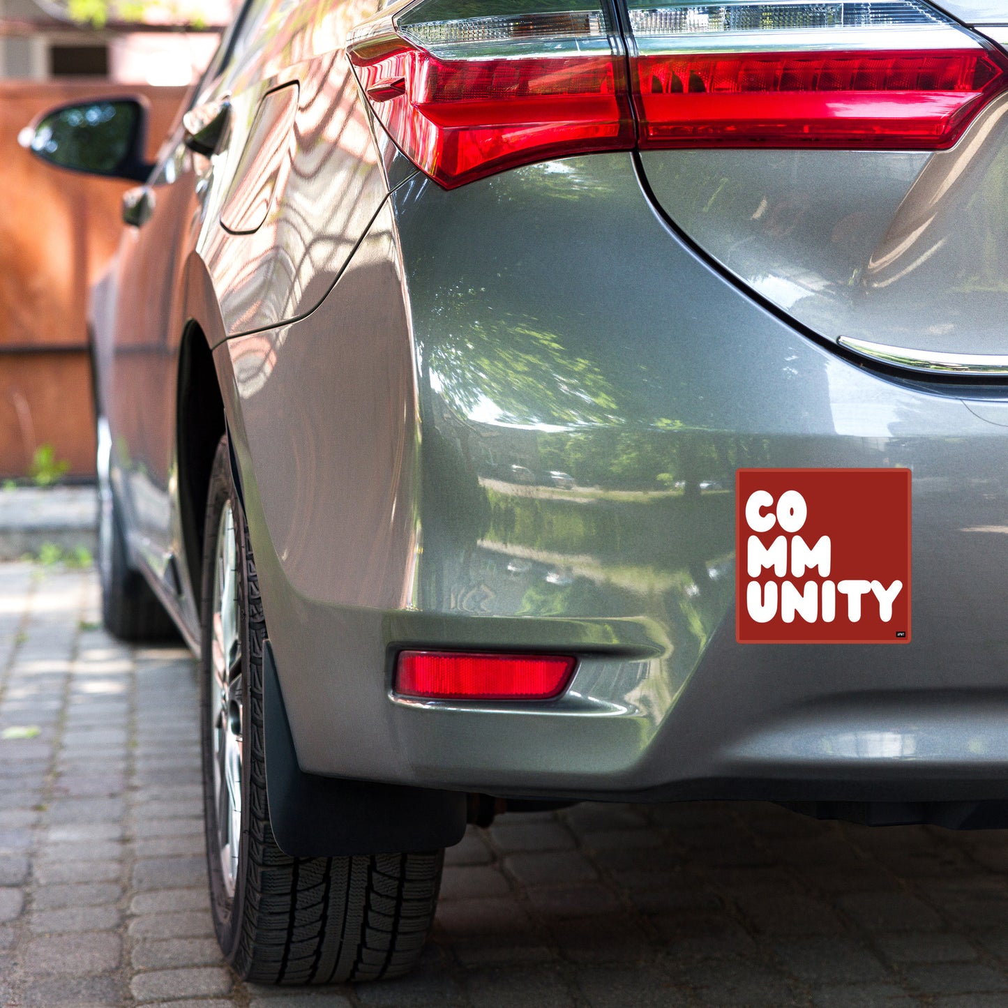 A Community in Apple Red Vinyl Sticker
