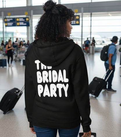 Woman wearing the APWT Gift Shop's the Bridal Party Premium Unisex Zip-Up Hoodie from the APWT Wedding Shop in Black