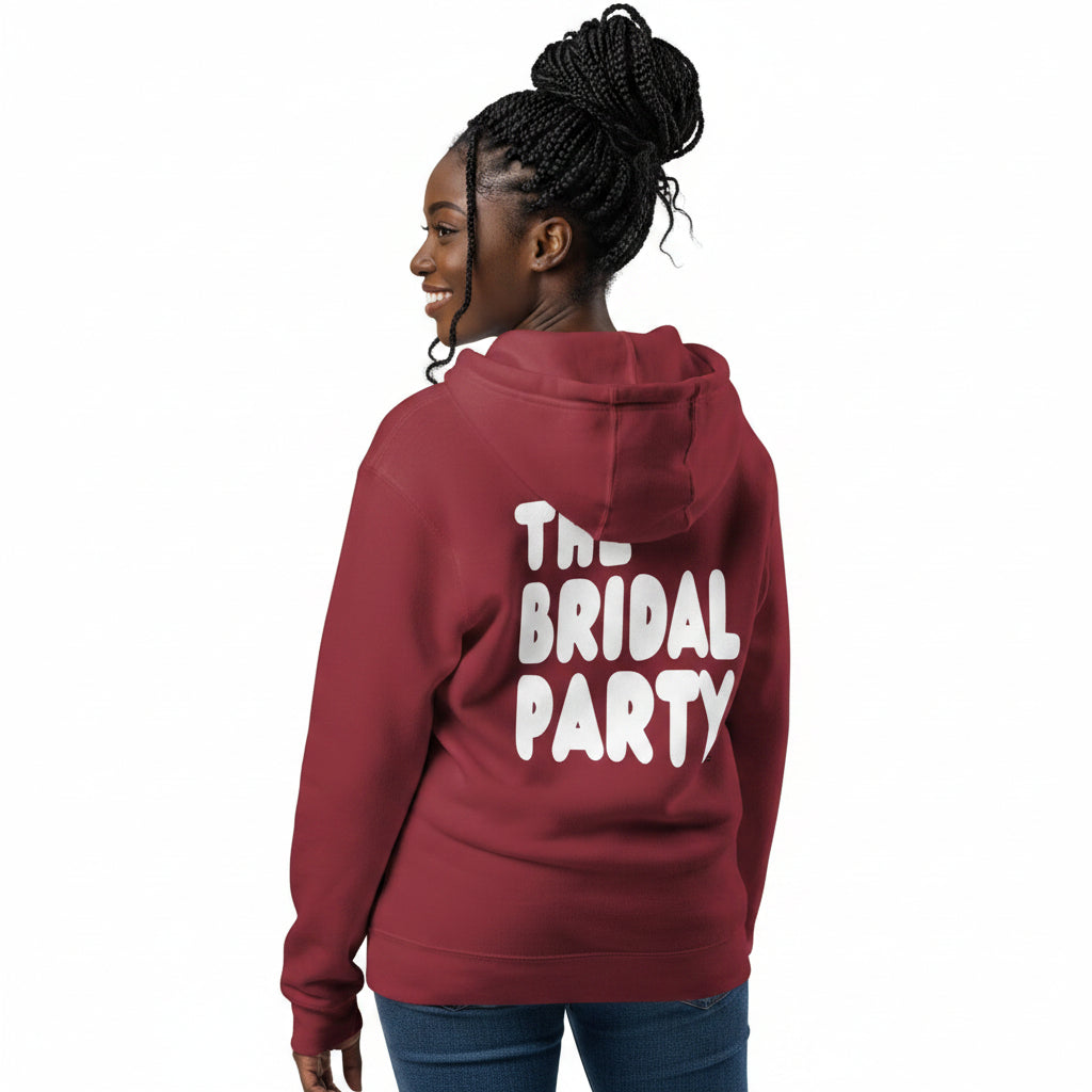 Woman wearing the APWT Gift Shop's the Bridal Party Premium Unisex Zip-Up Hoodie from the APWT Wedding Shop in Burgundy