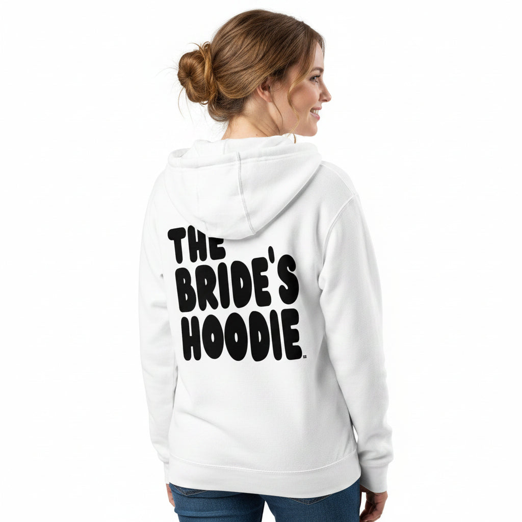 A woman shown from the back wearing a white the APWT Gift Shop's the Bride's Hoodie Premium Zip-Up White Hoodie from the APWT Wedding Shop