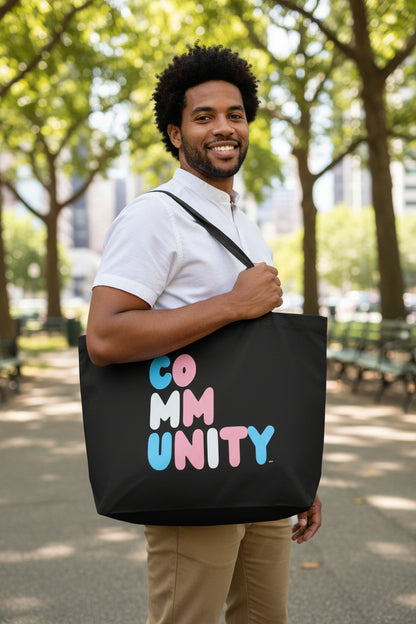 Man wearing the APWT Gift Shop's Be You Community Jumbo Black Tote Bag