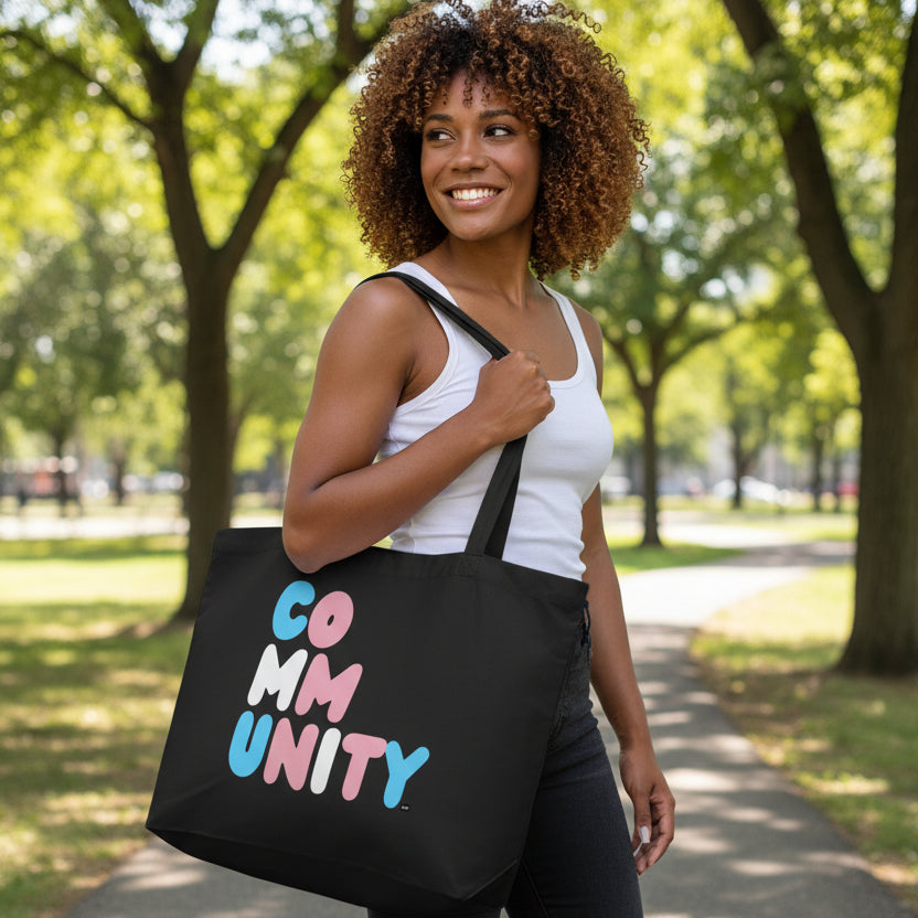 Woman wearing the APWT Gift Shop's Be You Community Jumbo Black Tote Bag