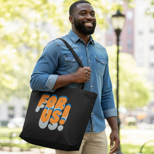 Man carrying the APWT Gift Shop's For Us in Blue and Orange Jumbo Tote Bag from the For Us Collection in Black