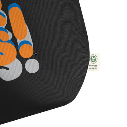 Close-up of tag on the APWT Gift Shop's For Us in Blue and Orange Jumbo Tote Bag from the For Us Collection