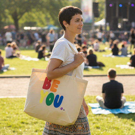 Woman wearing a Rainbow Be you Jumbo Tote Bag