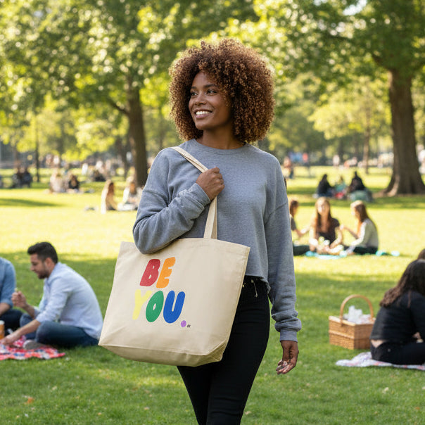 Woman wearing a Rainbow Be you Jumbo Tote Bag