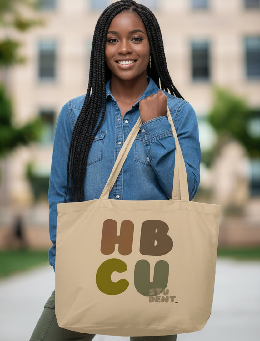 Woman holding the APWT Gift Shop's HBCU Student Jumbo Tote Bag from the Black Collection