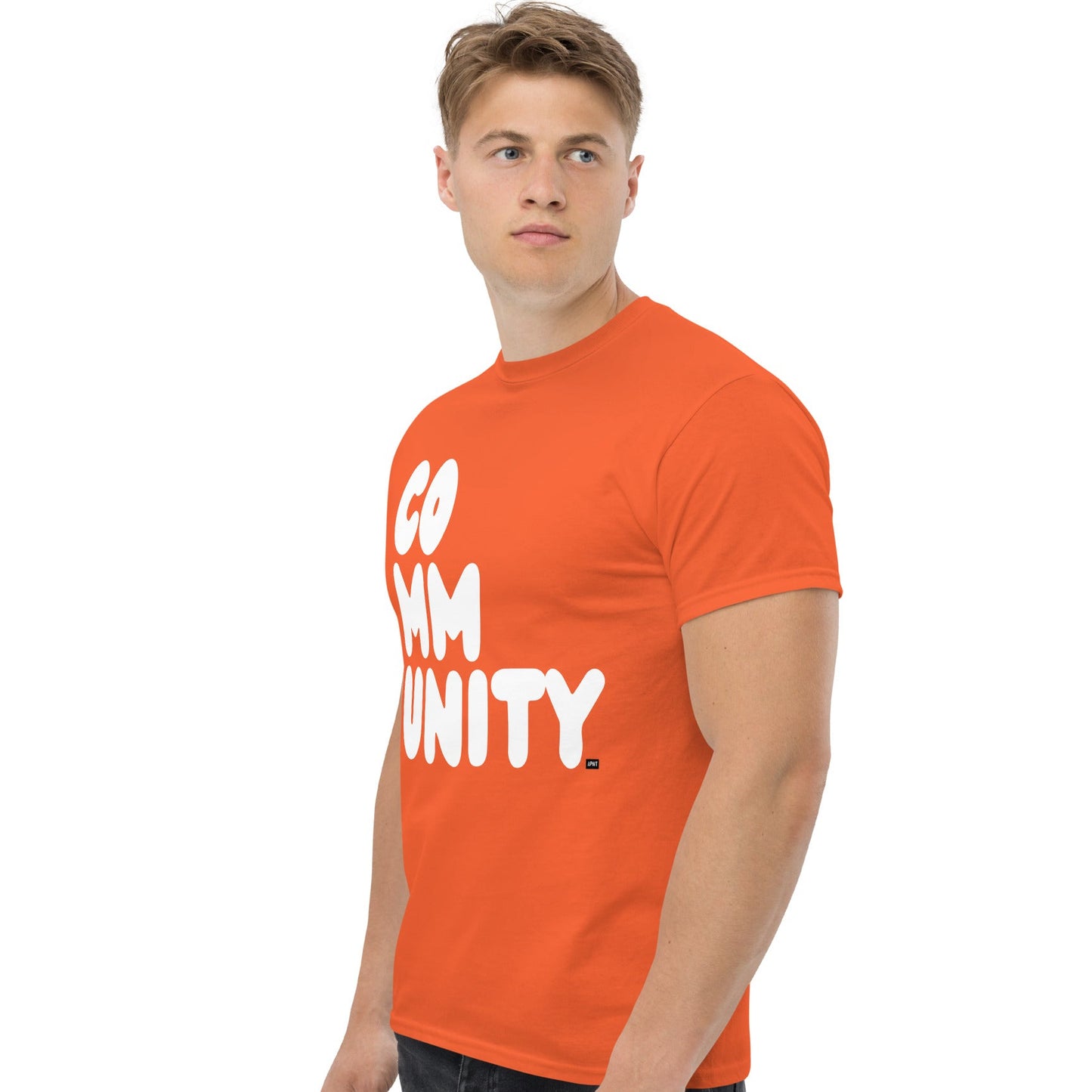 man wearing A Community in Orange Citrus Unisex T-Shirt from the APWT Gift Shop side