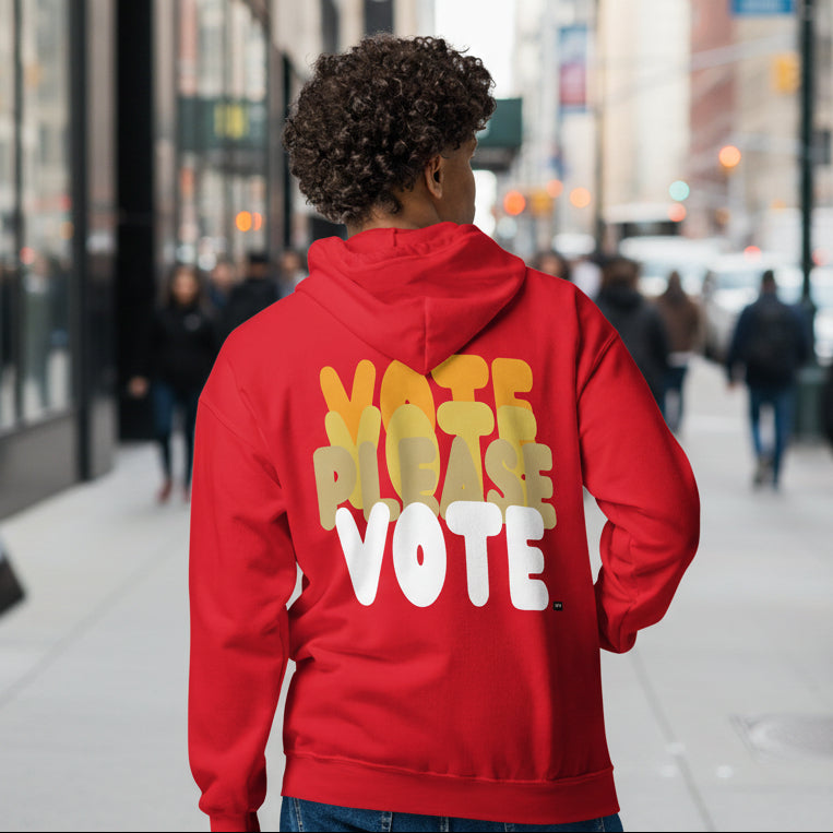 man wearing Please Vote in Cautionary Red Unisex Zip-Up Hoodie from the APWT Gift Shop