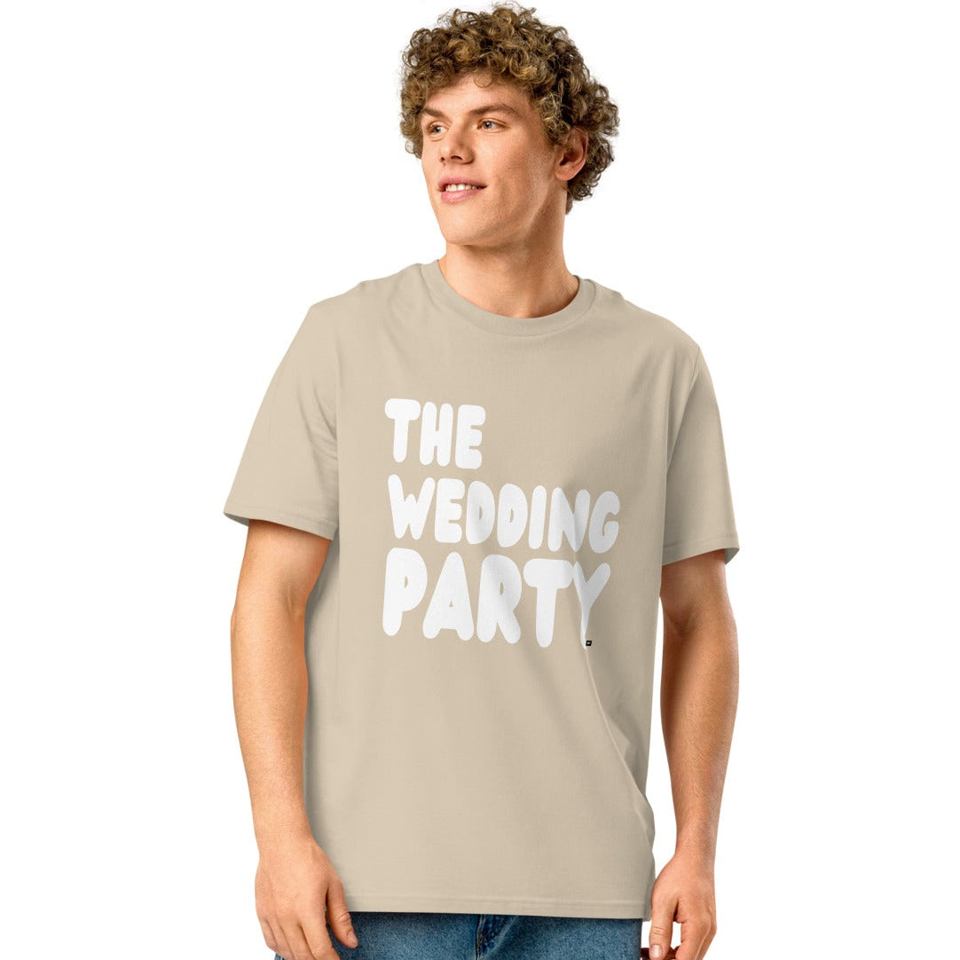 man wearing The Wedding Party Premium Unisex T-Shirt in Beige from the APWT Gift Shop
