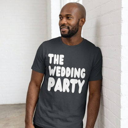 man wearing The Wedding Party Premium Unisex T-Shirt in Dark Grey from the APWT Gift Shop