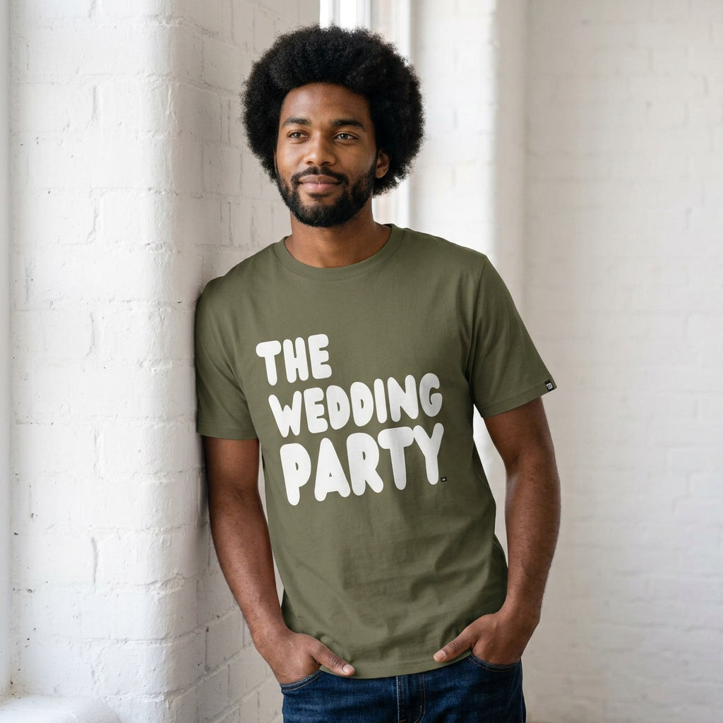 man wearing The Wedding Party Premium Unisex T-Shirt in Olive Green from the APWT Gift Shop