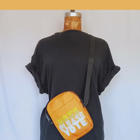 Please Vote in Orange Small Crossbody Bag - Product Demonstration