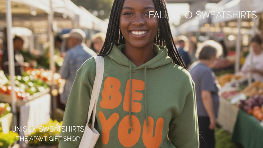 Woman walking through a farmer's market wearing on the APWT Gift Shop's Be You Unisex Hoodies 