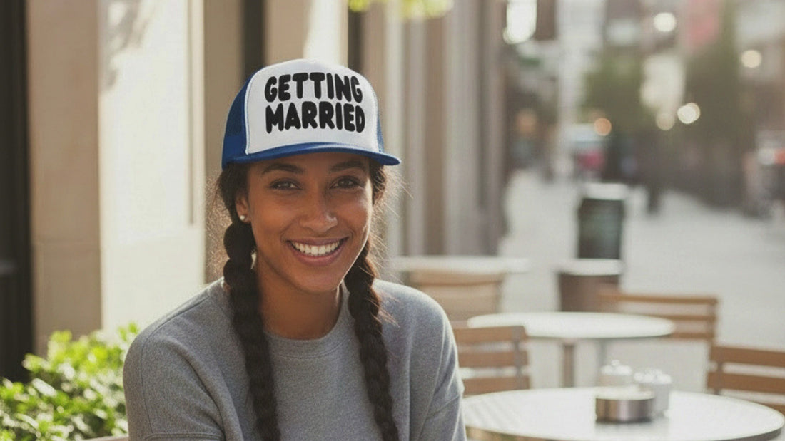 Woman wearing the APWT Gift Shop's Getting Married Trucker Hat in Royal Blue and White