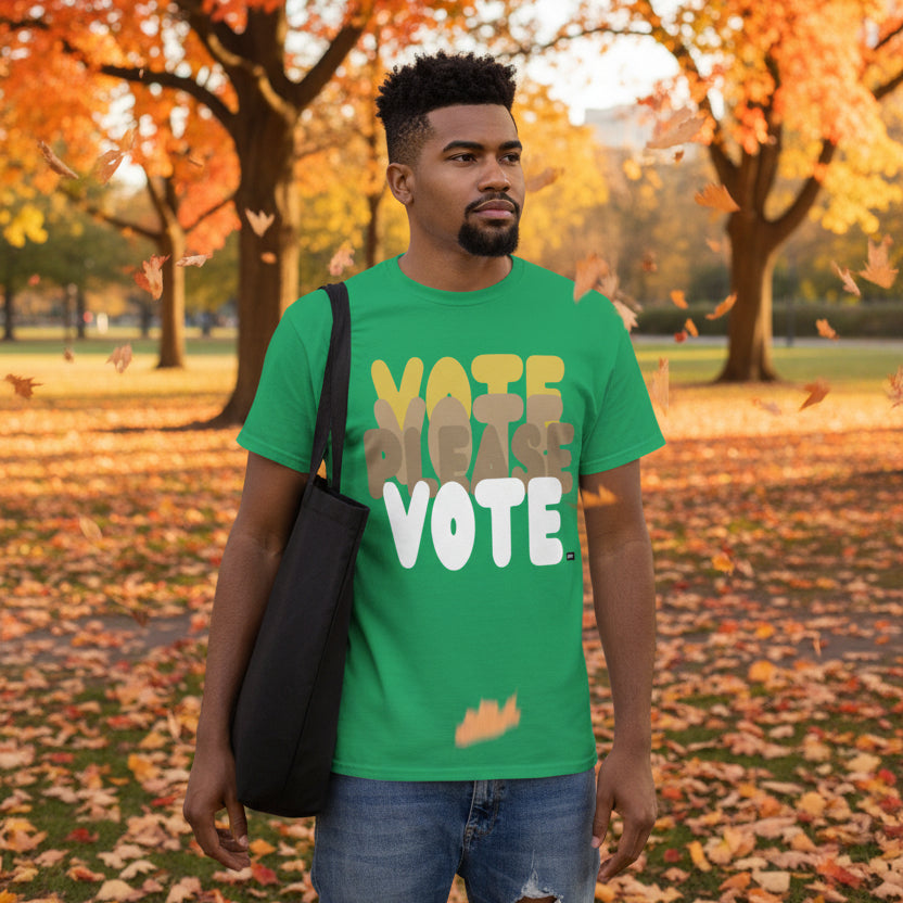 Man standing in the park on an autumn day wearing the APWT Gift Shop's Please Vote in Green Spaces Unisex T-Shirt from the APWT Vote Shop