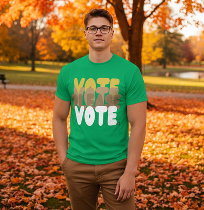 Man standing in the park on an autumn day wearing the APWT Gift Shop's Please Vote in Green Spaces Unisex T-Shirt from the APWT Vote Shop