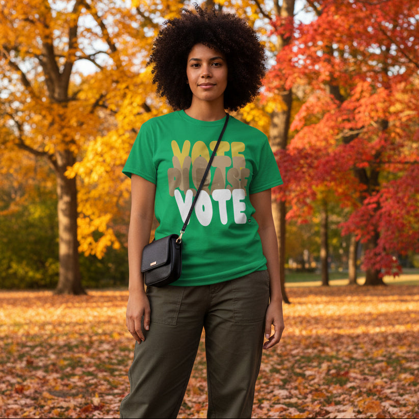 Woman standing in the park on an autumn day wearing the APWT Gift Shop's Please Vote in Green Spaces Unisex T-Shirt from the APWT Vote Shop
