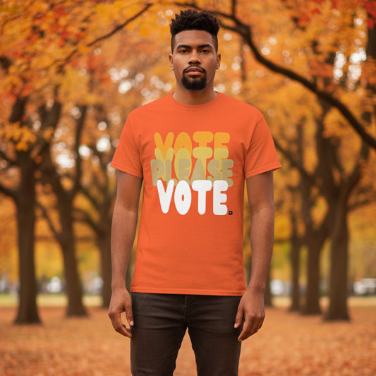 Man standing in the park on an autumn day wearing the APWT Gift Shop's Please Vote in Safety Cone Orange Unisex T-Shirt from the APWT Vote Shop