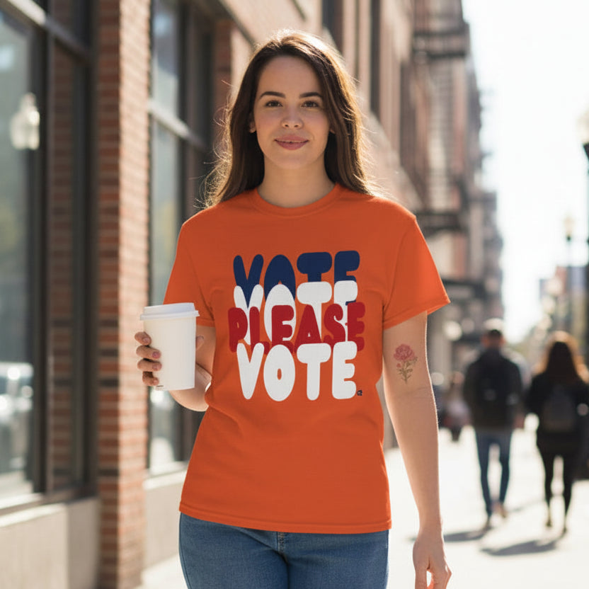 Woman wearing the APWT Gift Shop's Please Vote Unisex T-Shirt from the APWT Vote Shop in Orange 