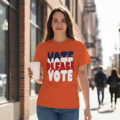 Woman wearing the APWT Gift Shop's Please Vote Unisex T-Shirt from the APWT Vote Shop in Orange 