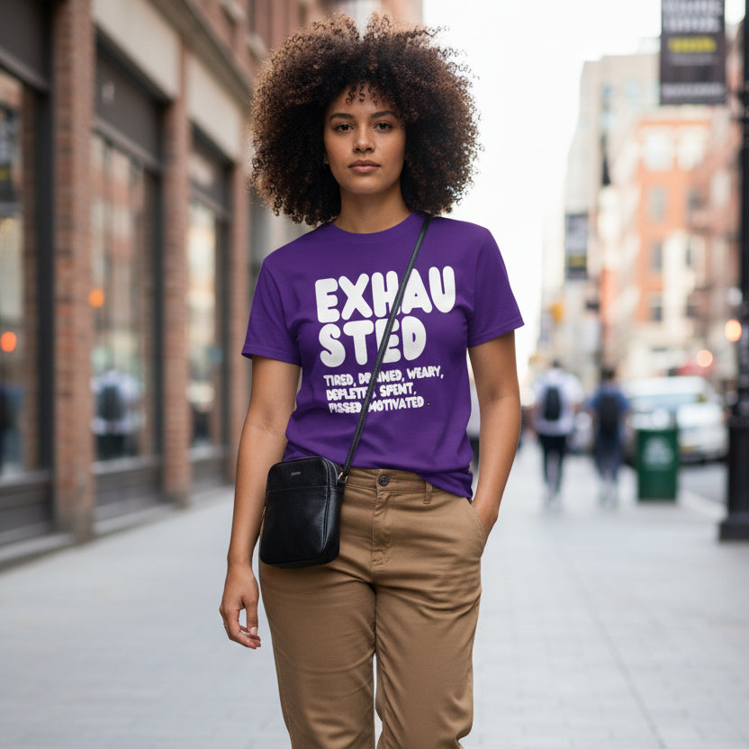 Woman walking down the street wearing the APWT Gift Shop's Exhausted in Purple Unisex T-Shirt from the Exhausted Collection