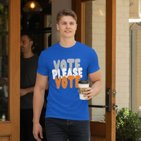 Man walking out of a cafe wearing the APWT Gift Shop's Please Vote in Blue and Orange Unisex T-Shirt from the Community Collection
