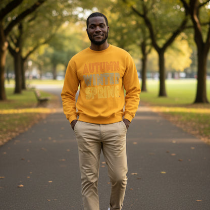 Man walking through the park wearing the APWT Gift Shop's Fall in Autumn Unisex Crew Neck Sweatshirt from the Day in the Life Collection in Yellow/Gold