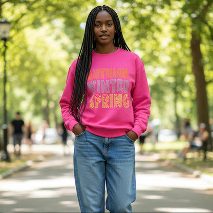 Woman walking through the park wearing the APWT Gift Shop's Fall in Autumn Unisex Crew Neck Sweatshirt from the Day in the Life Collection in Hot Pink