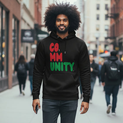 Man walking down a city sidewalk wearing the APWT Gift Shop's Black Community Premium Unisex Hoodie from the Community Collection and the Black Collection