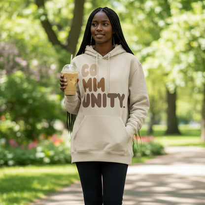 Woman wearing The APWT Gift Shop's Our Community Premium Unisex Hoodie from the Community Collection and the Premium Basics Collection in Beige