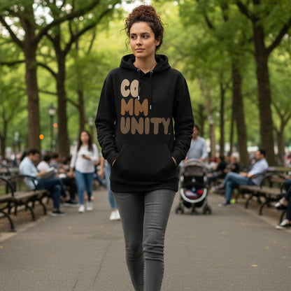 Woman wearing The APWT Gift Shop's Our Community Premium Unisex Hoodie from the Community Collection and the Premium Basics Collection in Black