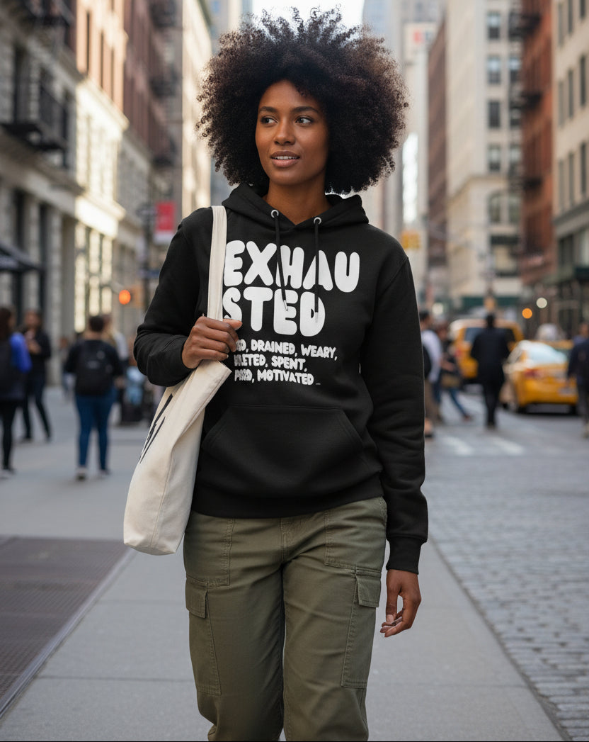 Woman wearing the APWT Gift Shop's Exhausted in Black and White Premium Unisex Hoodie from the Exhausted Collection and the Premium Basics Collection