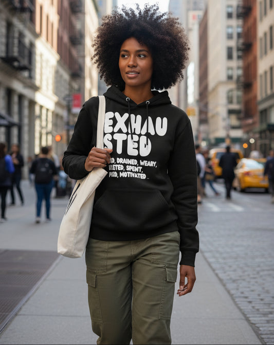 Woman wearing the APWT Gift Shop's Exhausted in Black and White Premium Unisex Hoodie from the Exhausted Collection and the Premium Basics Collection