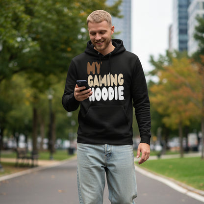 Man walking through city park wearing the APWT Gift Shop's My Gaming Hoodie Premium Unisex Hoodie from the Day in the Life Collection in Black