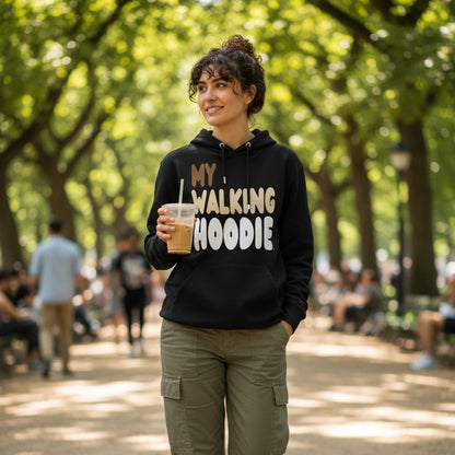 Woman walking down a city street wearing the APWT Gift Shop's My Walking Hoodie Premium Unisex Hoodie from the Day in the Life Collection in Black