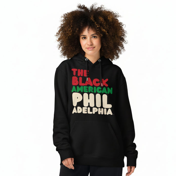 Woman wearing the APWT Gift Shop's the Black American Philadelphia Premium Unisex Hoodie from the Black Collection