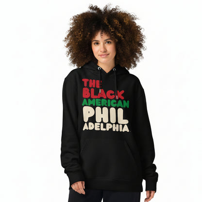 Woman wearing the APWT Gift Shop's the Black American Philadelphia Premium Unisex Hoodie from the Black Collection