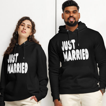 Couple wearing Just Married Premium Unisex Hoodie in Black