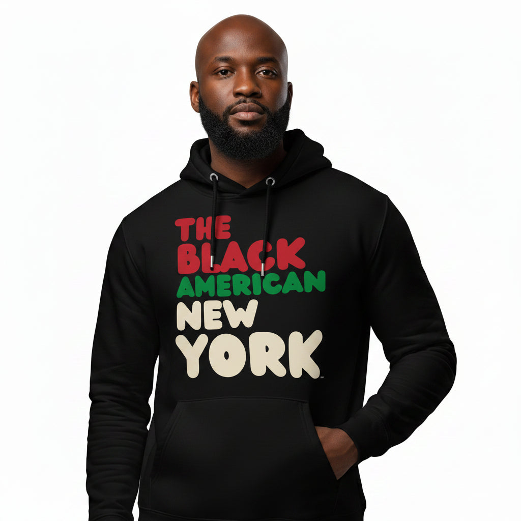 Man wearing the APWT Gift Shop's the Black American New York Premium Unisex Hoodie from the Black Collection