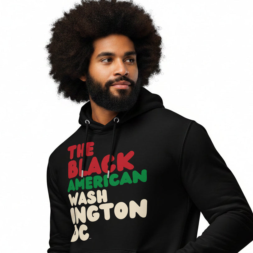 Man wearing the APWT Gift Shop's the Black American Washington DC Premium Unisex Hoodie from the Black Collection