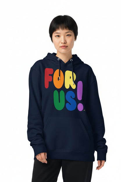 Woman wearing the APWT Gift Shop's Rainbow For Us Premium Unisex Hoodie featuring the 'For Us' message in the colors of the LGBTQ+ Pride Flag