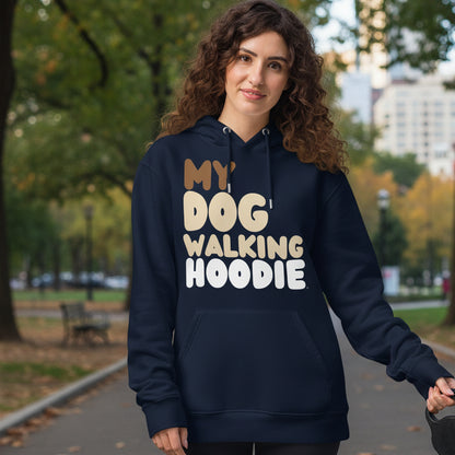 Woman standing in a city park wearing the APWT Gift Shop's My Dog Walking Hoodie Premium Unisex Hoodie from the Day in the Life Collection in Navy Blue