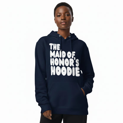Woman wearing the APWT Gift Shop's Maid of Honor's Hoodie Premium Unisex Hoodie from the APWT Wedding Shop in Navy Blue