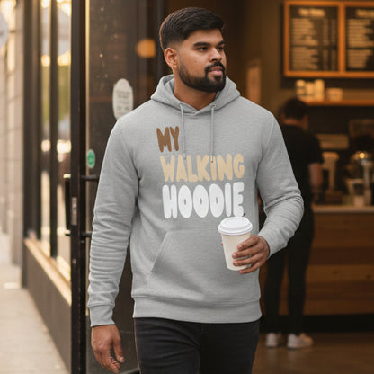 Man walking out of a coffee shop wearing the APWT Gift Shop's My Walking Hoodie Premium Unisex Hoodie from the Day in the Life Collection in Grey