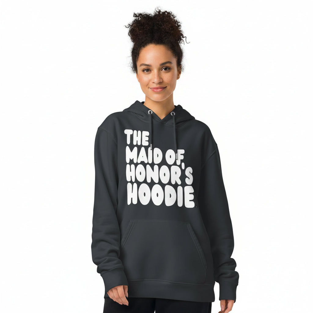 Woman wearing the APWT Gift Shop's Maid of Honor's Hoodie Premium Unisex Hoodie from the APWT Wedding Shop in Charcoal Grey
